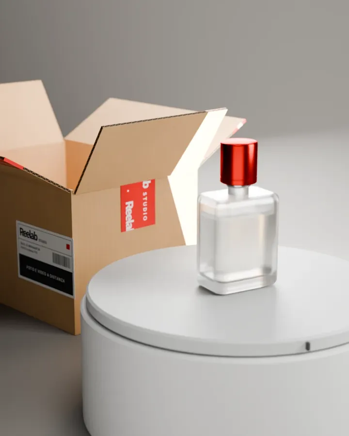 Shot 2, 3D render: the bottle in three-quarter view, with the open box beside it